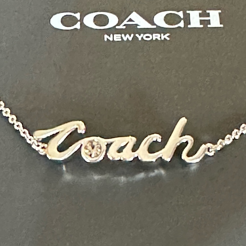 Coach silver slider bracelet with a crystal accent